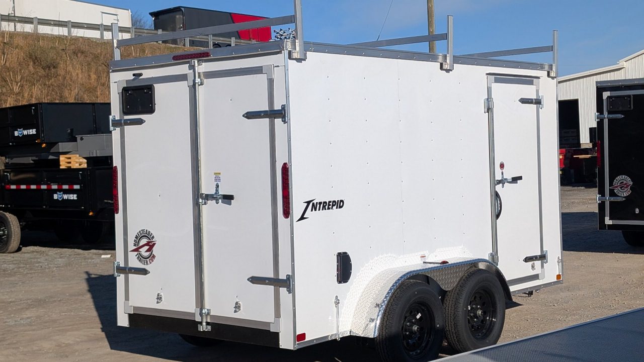 New 2026 Homesteader 6x12 Tandem Intrepid V-Nose Contractor Trailer w/ Rear Barn Doors & Ladder Racks