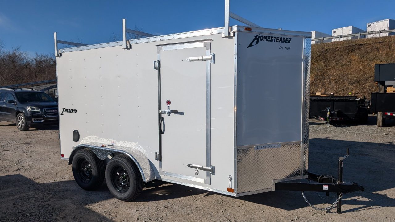 New 2026 Homesteader 6x12 Tandem Intrepid V-Nose Contractor Trailer w/ Rear Barn Doors & Ladder Racks