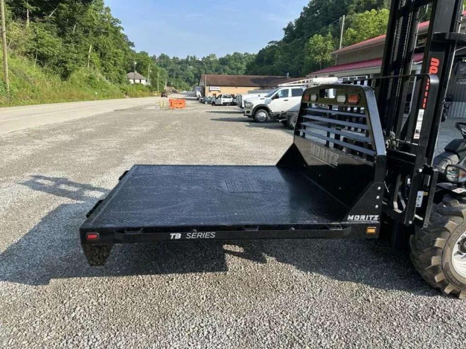 New Moritz International TB7-7 SRW 6.5' Flatbed w/Trap Door and Gooseneck Hitch Plate