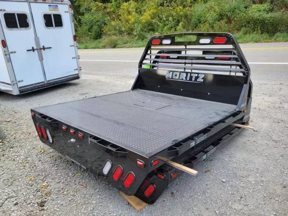 New Moritz International TB7-7 SRW 6.5' Flatbed w/Trap Door and Gooseneck Hitch Plate