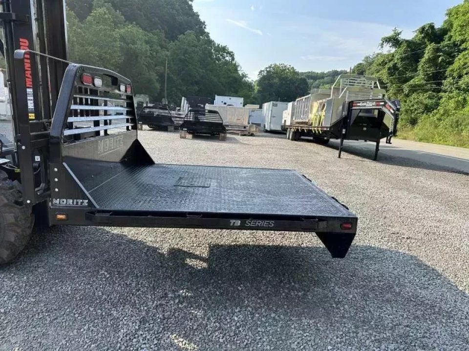 New Moritz International TB7-7 SRW 6.5' Flatbed w/Trap Door and Gooseneck Hitch Plate