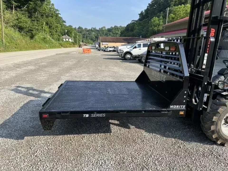 New Moritz International TB7-7 SRW 6.5' Flatbed w/Trap Door and Gooseneck Hitch Plate