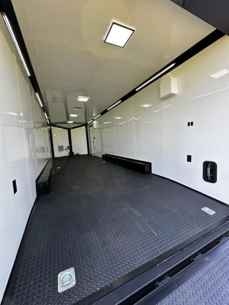 New 2026 Rock Solid Cargo 8.5x28 Race Trailer-Finished Interior-7'6" Interior - Triple 7000 TORSIONS -HD RAMP-10" BOGEY WHEELS