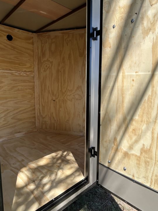 New 2026 Family Trailer 6x12 Tandem Axles Cargo / Enclosed Trailer-Screwless Exterior-Blackout Pkg.-Rear Spoiler-HD Axles
