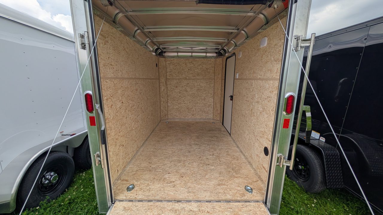 New 2026 LEGEND 6x10 Legend Deluxe Cargo Trailer w/ Ramp Door