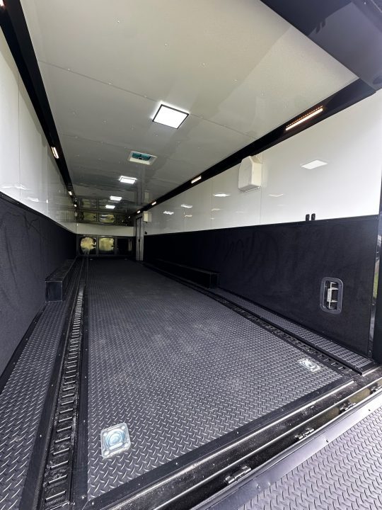 New 2026 Rock Solid Cargo 8.5x32 Race Trailer-Finished Interior-Triple 7000 TORSIONS -Carpet Walls-24ft Awning- Double Doors-E-Track-HD Ramp