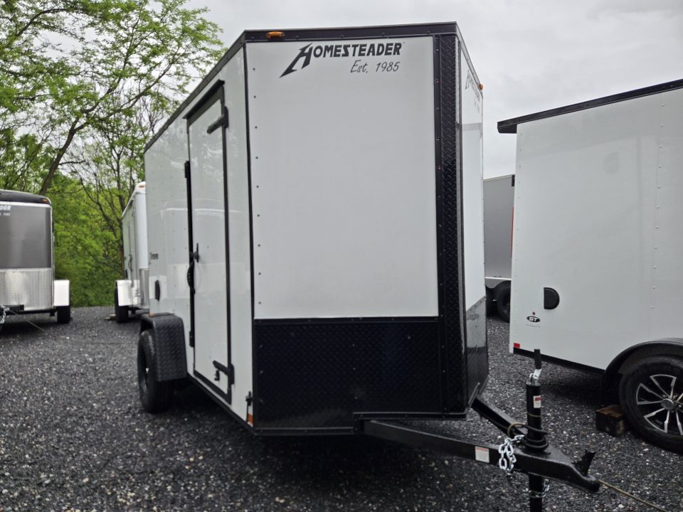 New 6 x 10 Homesteader Intrepid V-Nose Cargo Trailer, 3k *White w/ Black Out Pkg, Ramp Door Pkg & 6" Extra Height