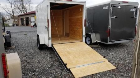 New 6 x 10 Homesteader Intrepid V-Nose Cargo Trailer, 3k *White w/ Black Out Pkg, Ramp Door Pkg & 6" Extra Height