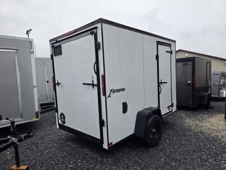 New 6 x 10 Homesteader Intrepid V-Nose Cargo Trailer, 3k *White w/ Black Out Pkg, Ramp Door Pkg & 6" Extra Height