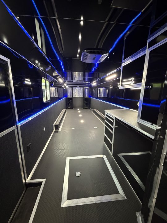 New 2026 Haulmark 34 Bathoom Race Trailer, Sliding Rear Glass Doors, Air Prep PKG, Awning, 2 A/C, Polycor, Insulated, Window, 54" ALX Slide Out Step, A/C + Heat