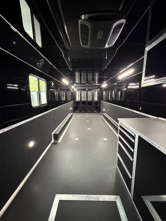New 2026 Haulmark 34 Bathoom Race Trailer, Sliding Rear Glass Doors, Air Prep PKG, Awning, 2 A/C, Polycor, Insulated, Window, 54" ALX Slide Out Step, A/C + Heat