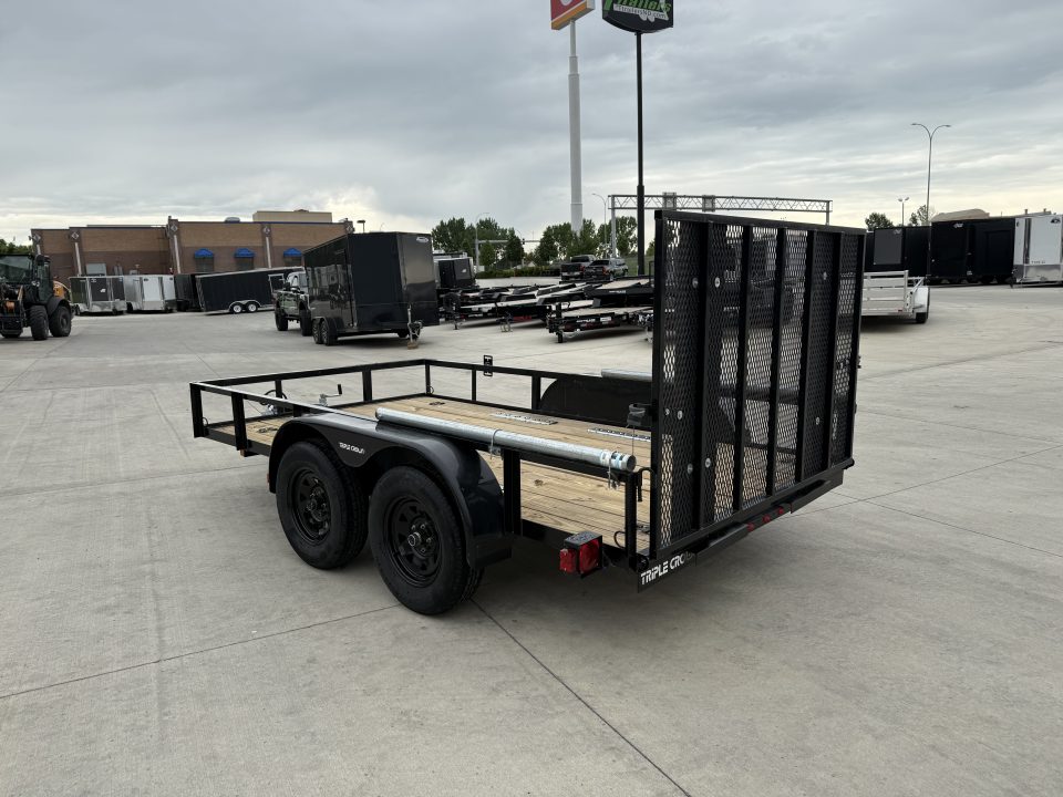 Used 2023 Triple Crown 77"x12' 2-3500lb axles = 7K Railside Utility with lift helpers springs