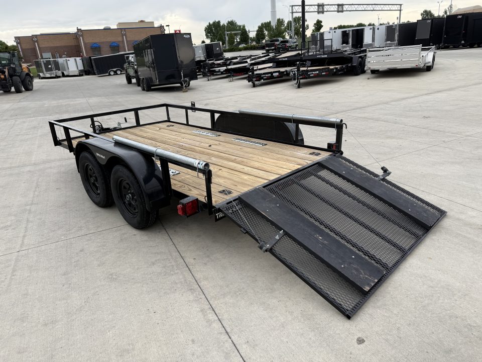 Used 2023 Triple Crown 77"x12' 2-3500lb axles = 7K Railside Utility with lift helpers springs