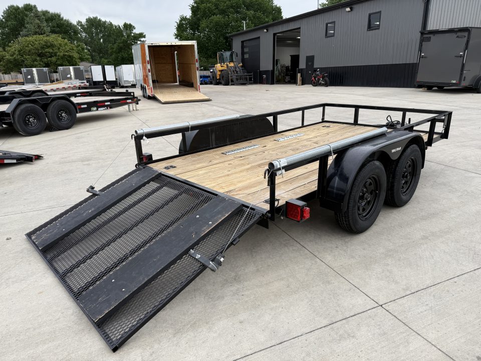 Used 2023 Triple Crown 77"x12' 2-3500lb axles = 7K Railside Utility with lift helpers springs