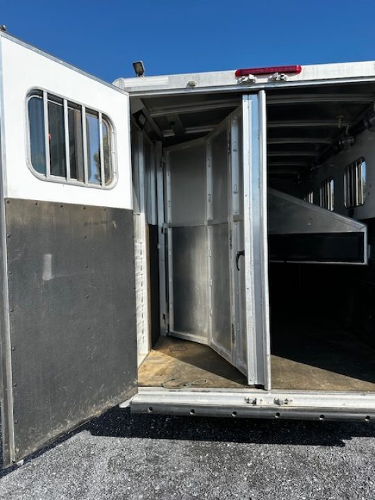 Used 2014 Exiss Trailers 7400 GN 4-H Slant Horse Trailer