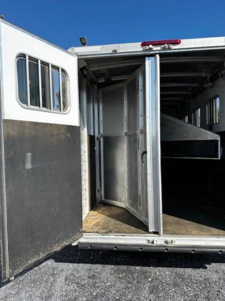 Used 2014 Exiss Trailers 7400 GN 4-H Slant Horse Trailer