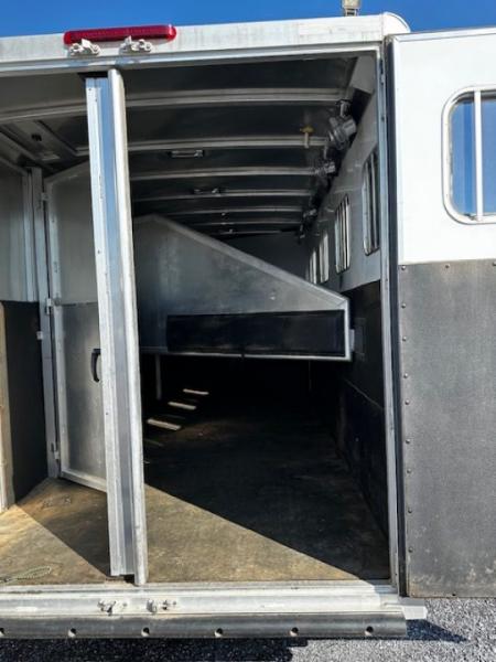 Used 2014 Exiss Trailers 7400 GN 4-H Slant Horse Trailer