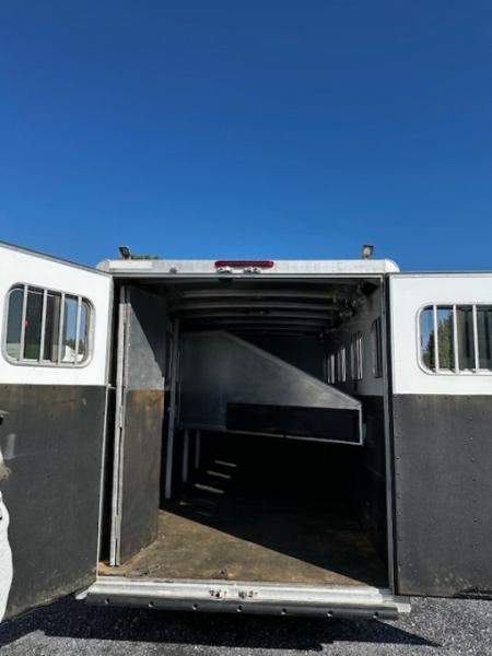Used 2014 Exiss Trailers 7400 GN 4-H Slant Horse Trailer