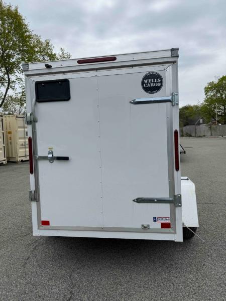 New 2026 Wells Cargo FT58S2-D Cargo / Enclosed Trailer