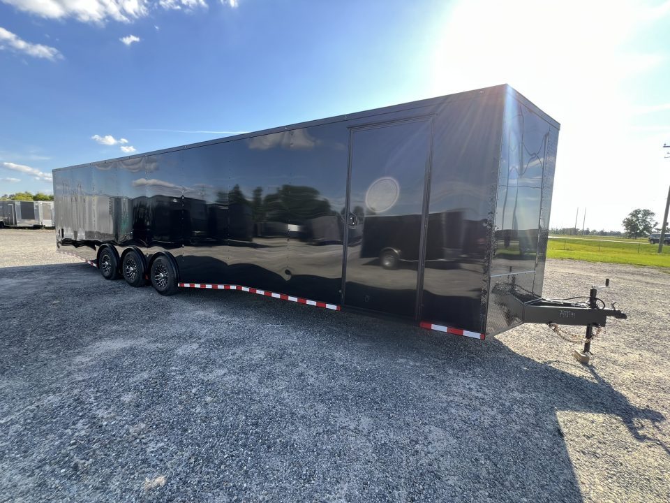 New 2027 Rock Solid Cargo 8.5x36 Triple Axle Enclosed Car Hauler – Black Polycore Super Stealth Blackout Package