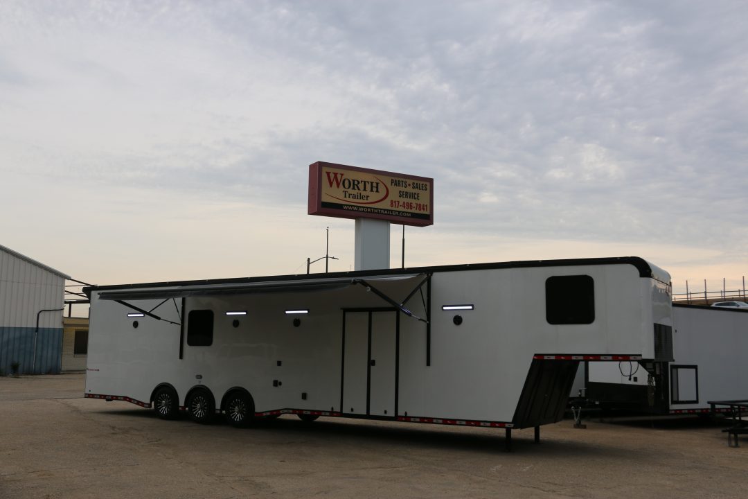 New 8.5 X 44 ELIMINATOR SS RACE TRAILER W/ BATH, BED AND MUCH MORE
