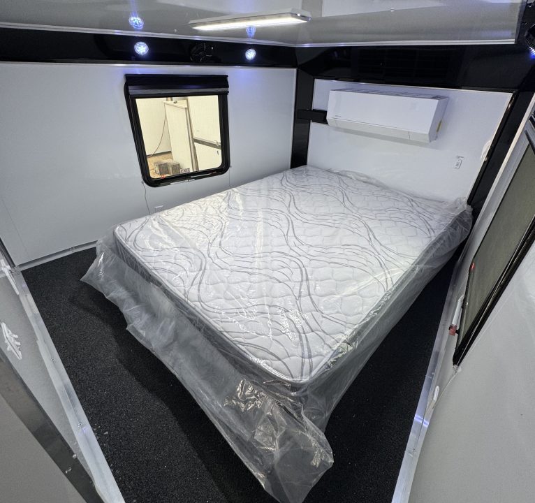 New 8.5 X 44 ELIMINATOR SS RACE TRAILER W/ BATH, BED AND MUCH MORE