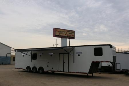 New 8.5 X 44 ELIMINATOR SS RACE TRAILER W/ BATH, BED AND MUCH MORE