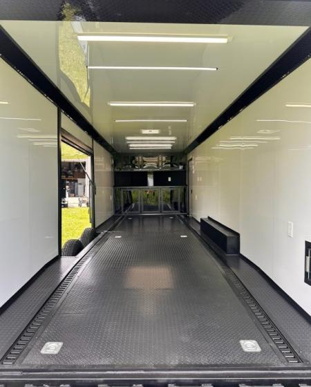 New 2026 Luxe 8.5x28 Race Trailer - Finished Interior- 7000lb Spread Torsion - Recessed E-Track-Full Escape Door-Removable Fender