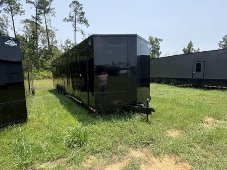New 2027 Rock Solid Cargo 8.5x36 Triple Axle Enclosed Car Hauler – Black Polycore | Super Stealth Blackout Edition
