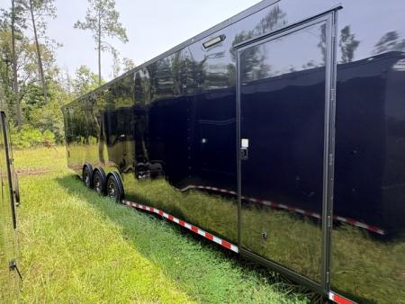 New 2027 Rock Solid Cargo 8.5x36 Triple Axle Enclosed Car Hauler – Black Polycore | Super Stealth Blackout Edition
