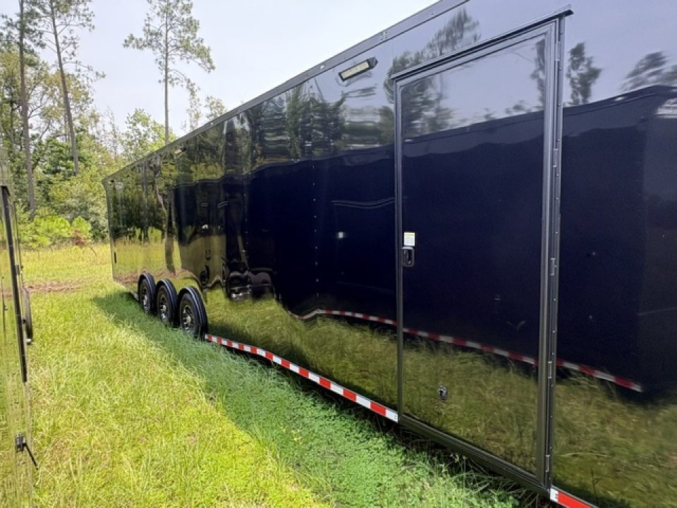 New 2027 Rock Solid Cargo 8.5x36 Triple Axle Enclosed Car Hauler – Black Polycore | Blackout Package