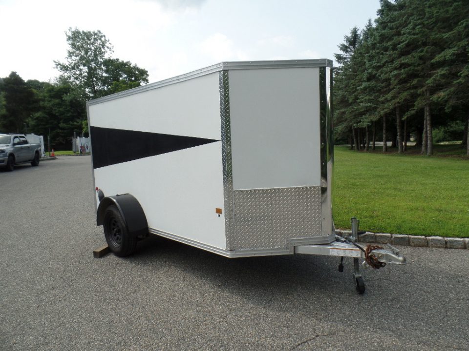 Used 2025 ALCOM 5' by 10 ft. , with 2,990 lb. GVWR, 67" interior height Cargo / Enclosed Trailer