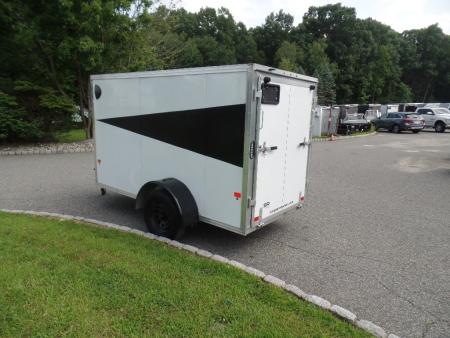 Used 2025 ALCOM 5' by 10 ft. , with 2,990 lb. GVWR, 67" interior height Cargo / Enclosed Trailer