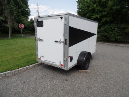 Used 2025 ALCOM 5' by 10 ft. , with 2,990 lb. GVWR, 67" interior height Cargo / Enclosed Trailer