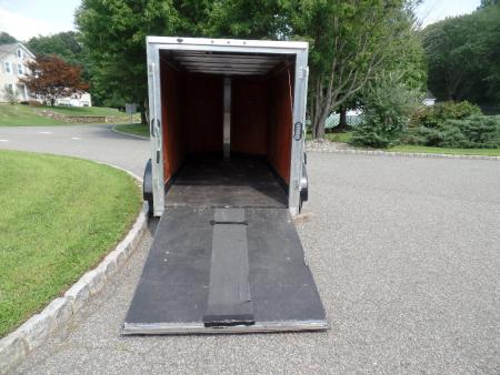 Used 2025 ALCOM 5' by 10 ft. , with 2,990 lb. GVWR, 67" interior height Cargo / Enclosed Trailer