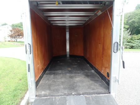 Used 2025 ALCOM 5' by 10 ft. , with 2,990 lb. GVWR, 67" interior height Cargo / Enclosed Trailer