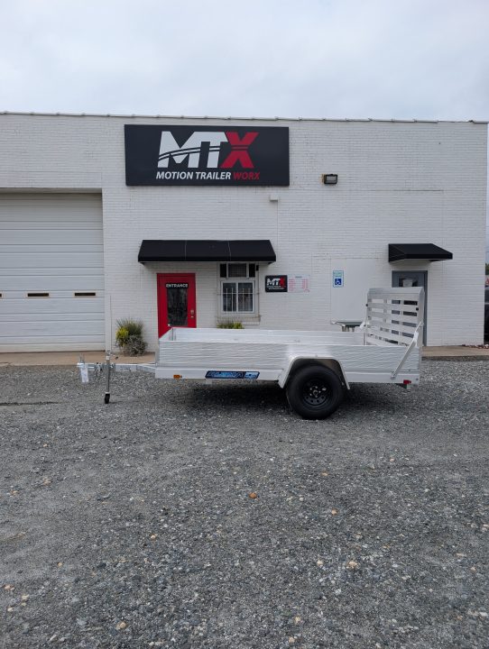 New 2026 Aluma 7810ES Solid Sides and Gate Utility Trailer