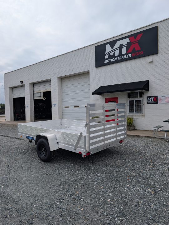 New 2026 Aluma 7810ES Solid Sides and Gate Utility Trailer