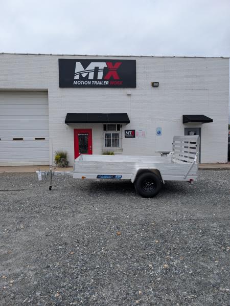 New 2026 Aluma 7810ES Solid Sides and Gate Utility Trailer