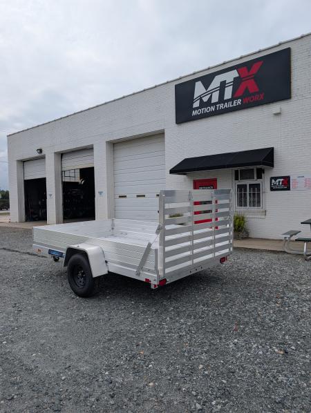 New 2026 Aluma 7810ES Solid Sides and Gate Utility Trailer