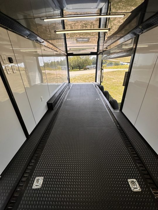 New 2027 8.5x28 Race Trailer-Finished Interior-7000LB Triple Torsion-- RECESSED E TRACK-Awning-Double Doors-GEN BOX