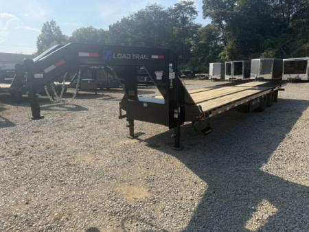 New Load Trail Gooseneck 102x32 Hydraulic Dovetail 24K Black W/ Raised Neck, Pipe Bridge, 17.5/16P & 12' Tail W/ Cleats