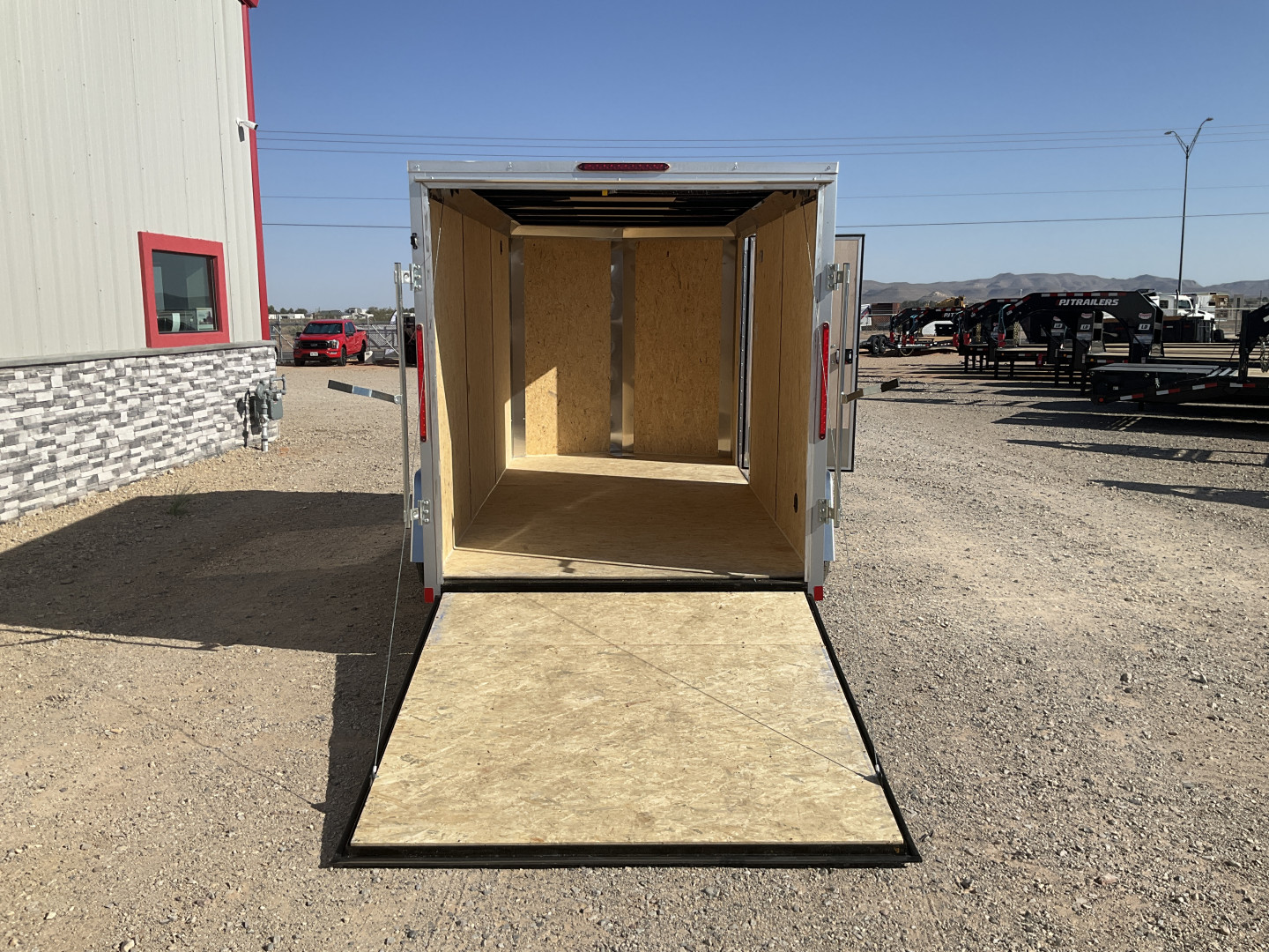 New 2025 Compass 6'x12' Enclosed Cargo Trailer - Indigo DLX
