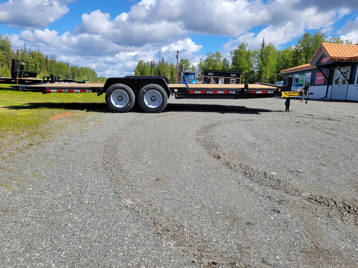 New 2025 Kaufman Trailers Deluxe Equipment Tilt Trailer