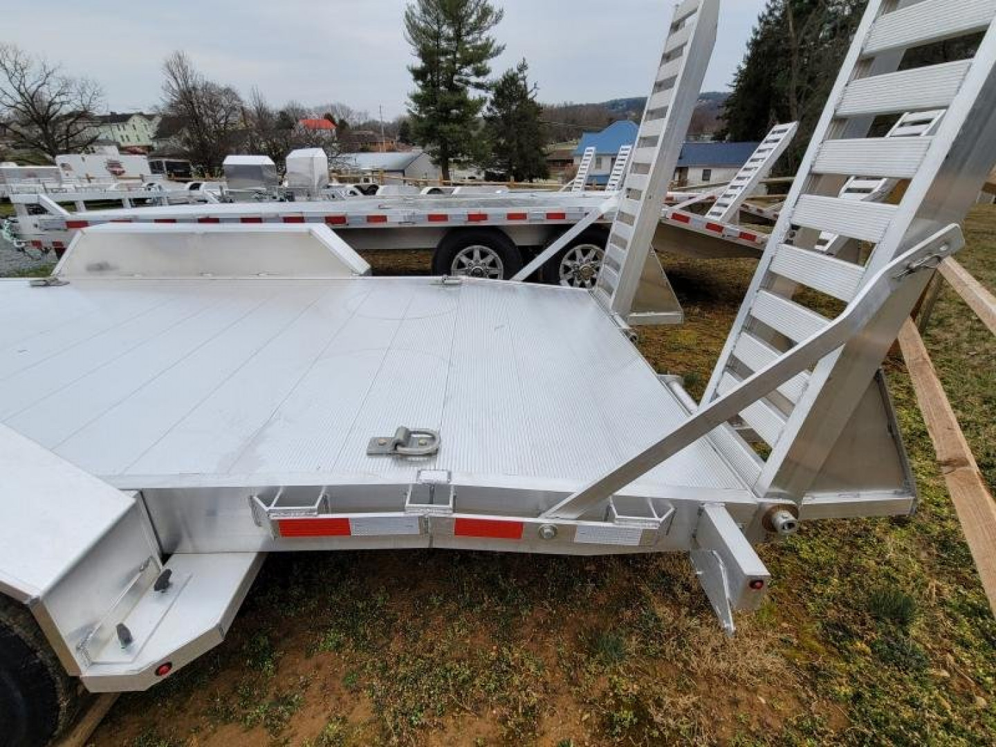 New 2024 Aluma 82x18 SKID STEER Equipment Trailer