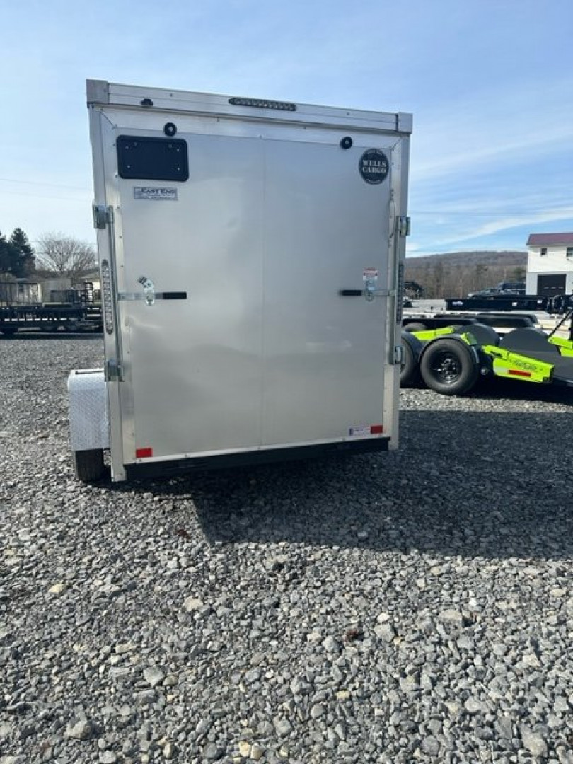 New 2024 Wells Cargo RFV610S2 Cargo / Enclosed Trailer 6'x10' 2990#