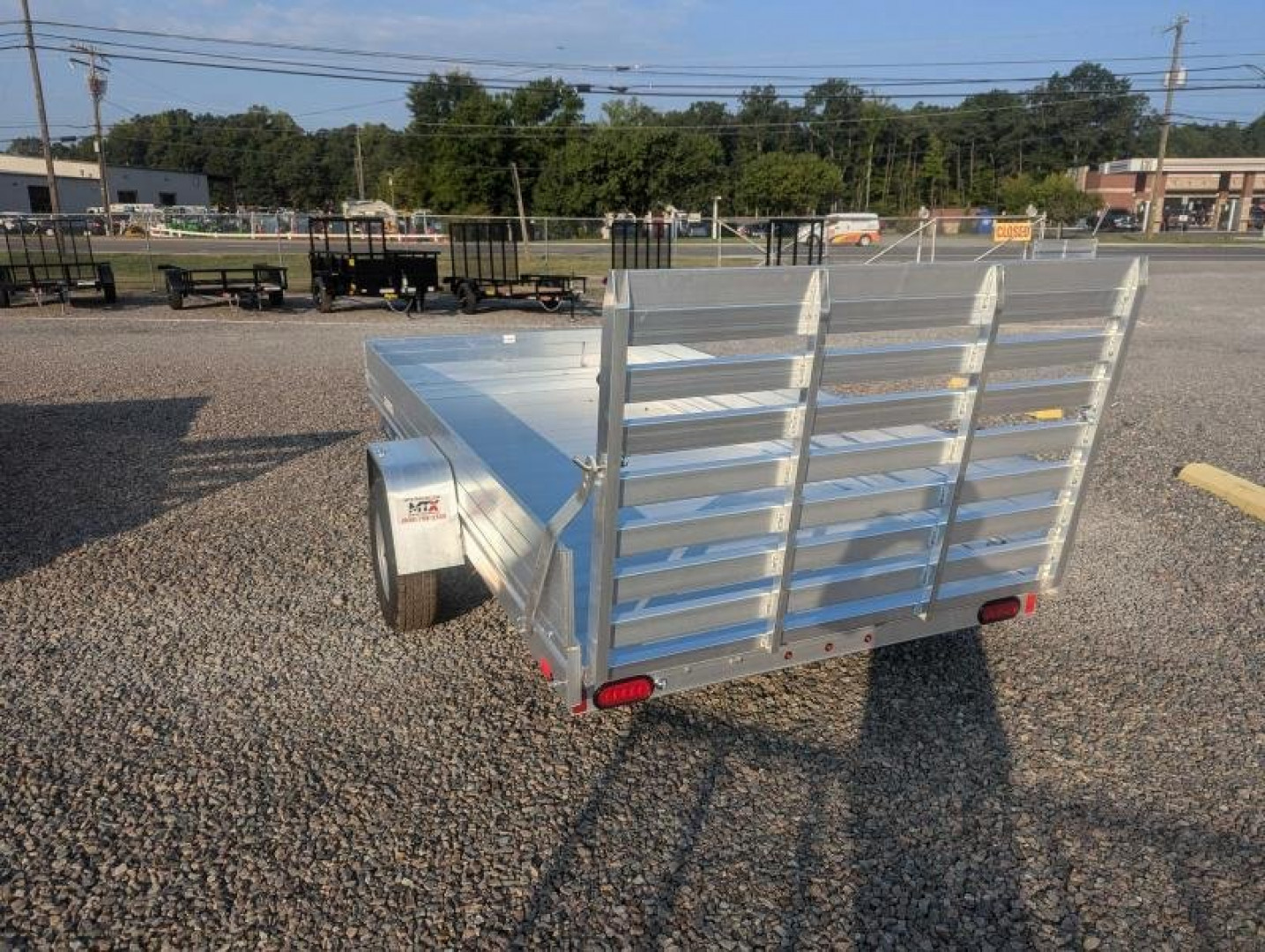 New 2025 ALUMA 6812H w/ 12" Solid Sides & Gate Utility Trailer
