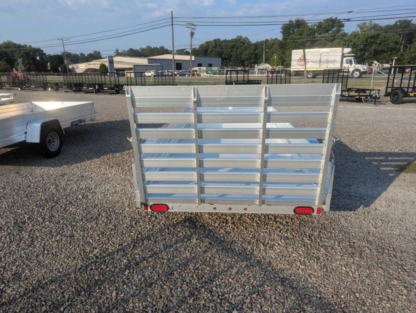 New 2025 ALUMA 6812H w/ 12" Solid Sides & Gate Utility Trailer