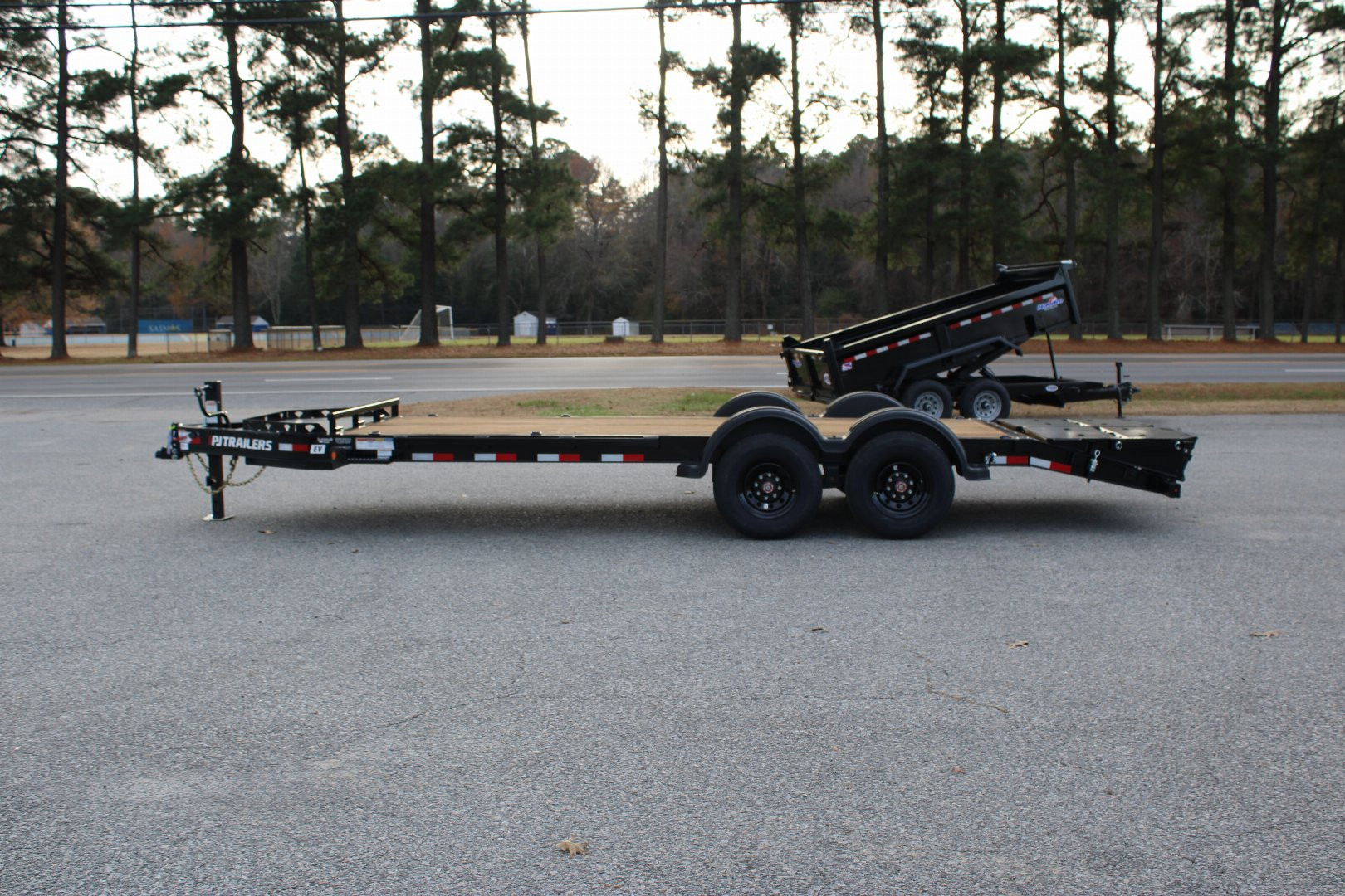 New 2025 PJ TRAILERS EV 20' Equipment Trailer w/ Monster Ramps *plus an additional $300 Rebate*
