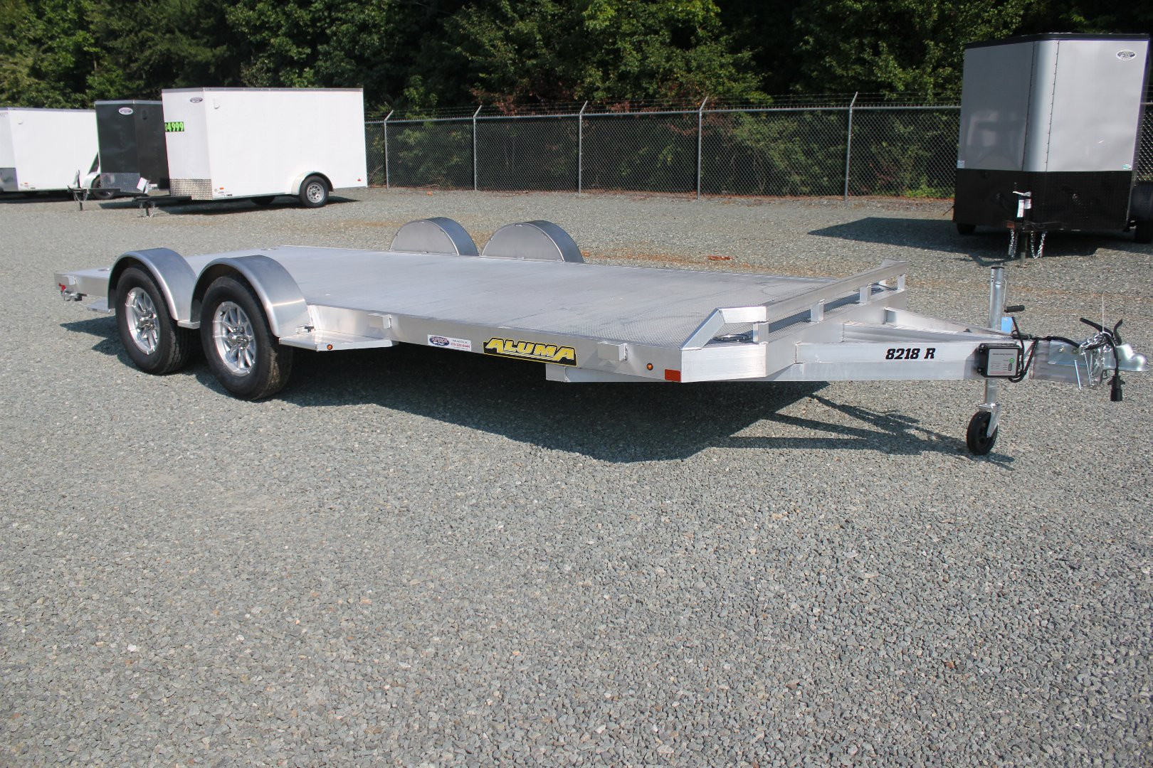 New 2025 Aluma 8218 w/ Slide Out Ramps Car Trailer